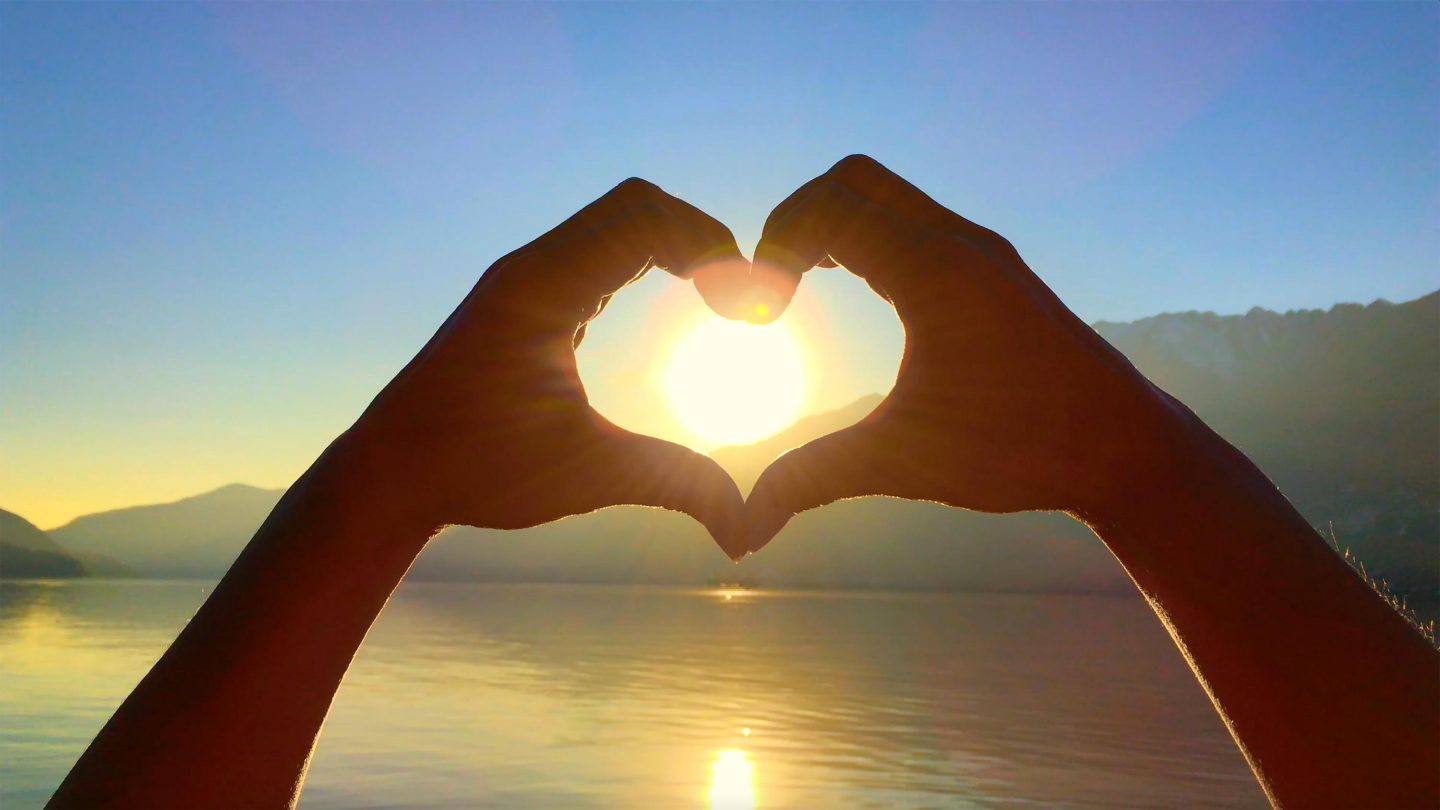 Heart Shape with Sunlight over Alpine Lake Maggiore and Mountain in Ascona, Switzerland.