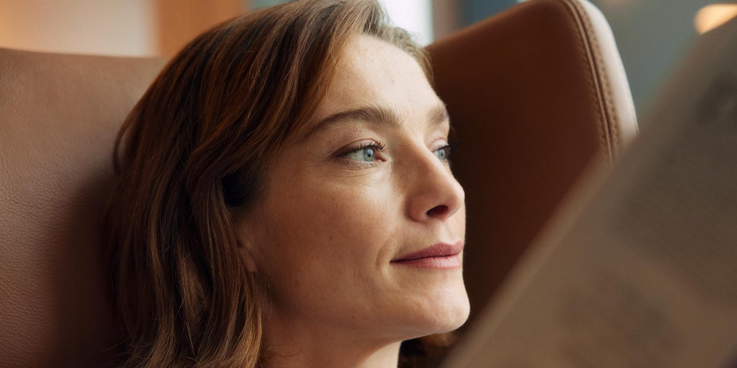 A woman sitting in the lounge.