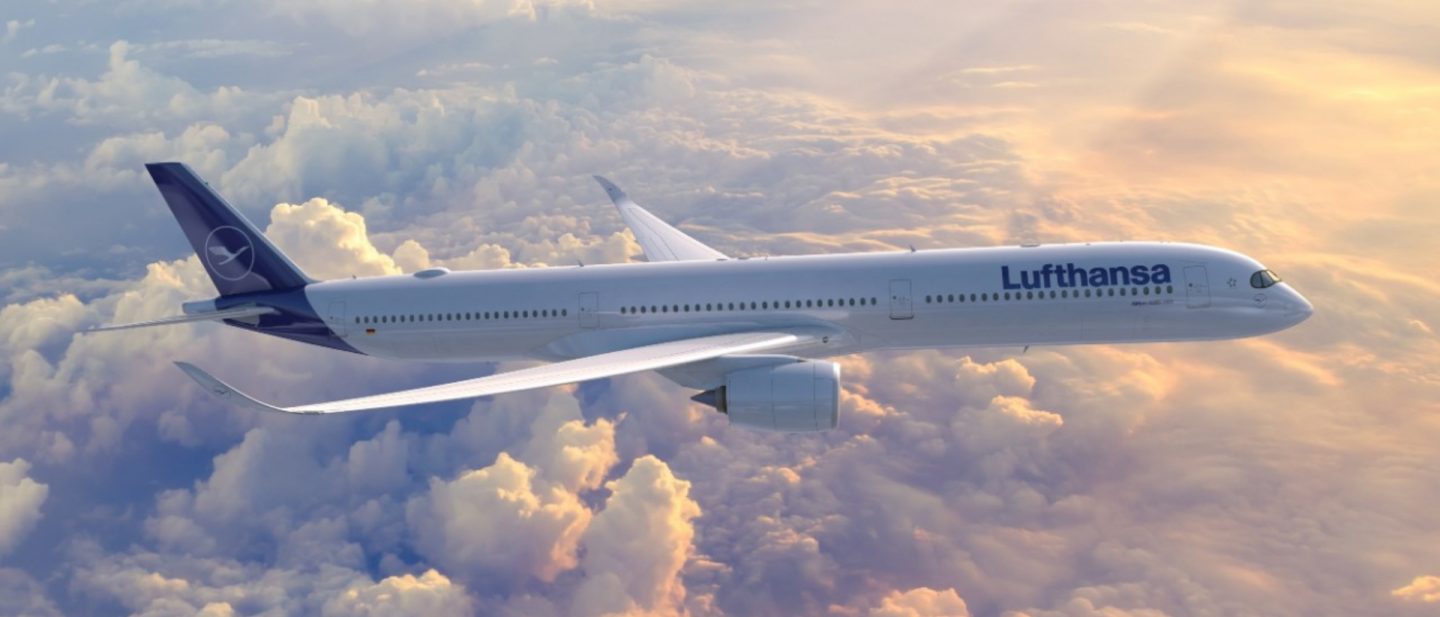 Lufthansa plane soaring above sun-drenched clouds.