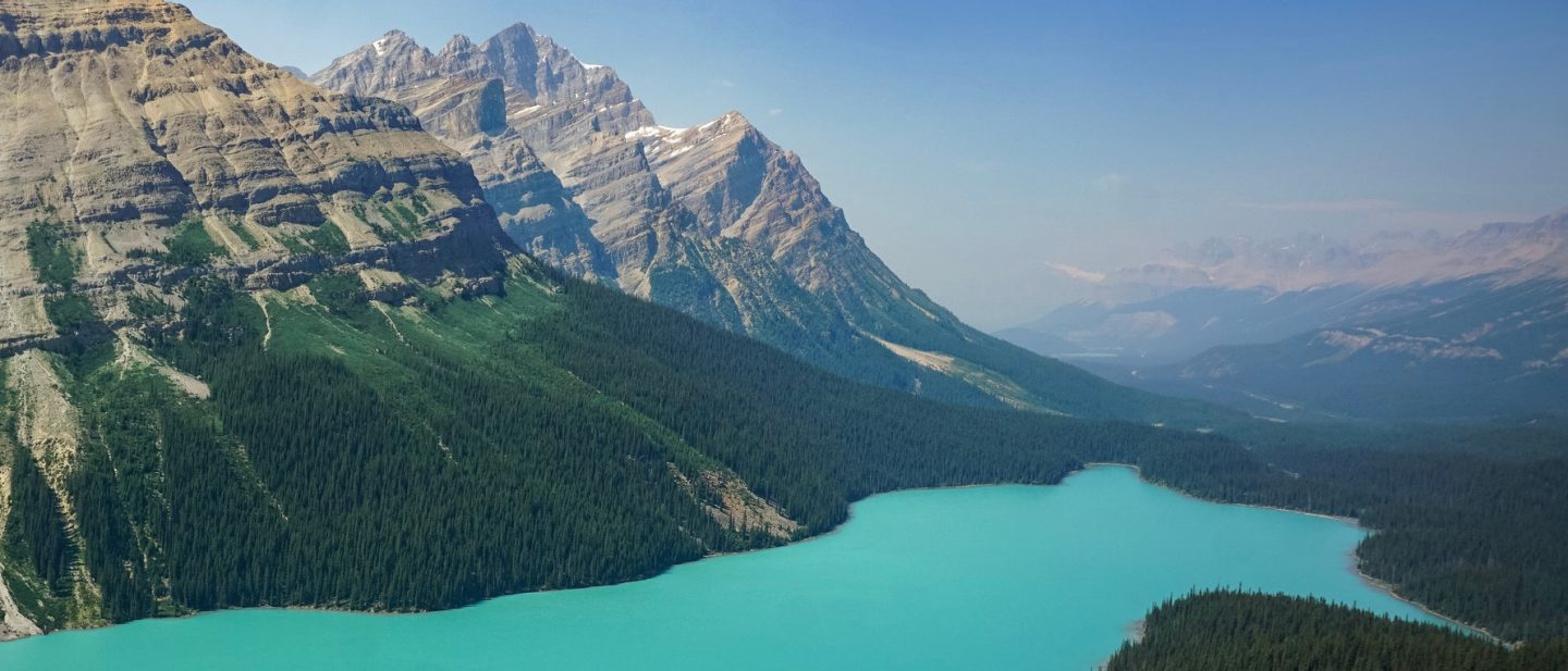 Peyto Lake in Alberta at Banff National Park in Canada with Glacier and Turquoise Green Water and Smoky Sky