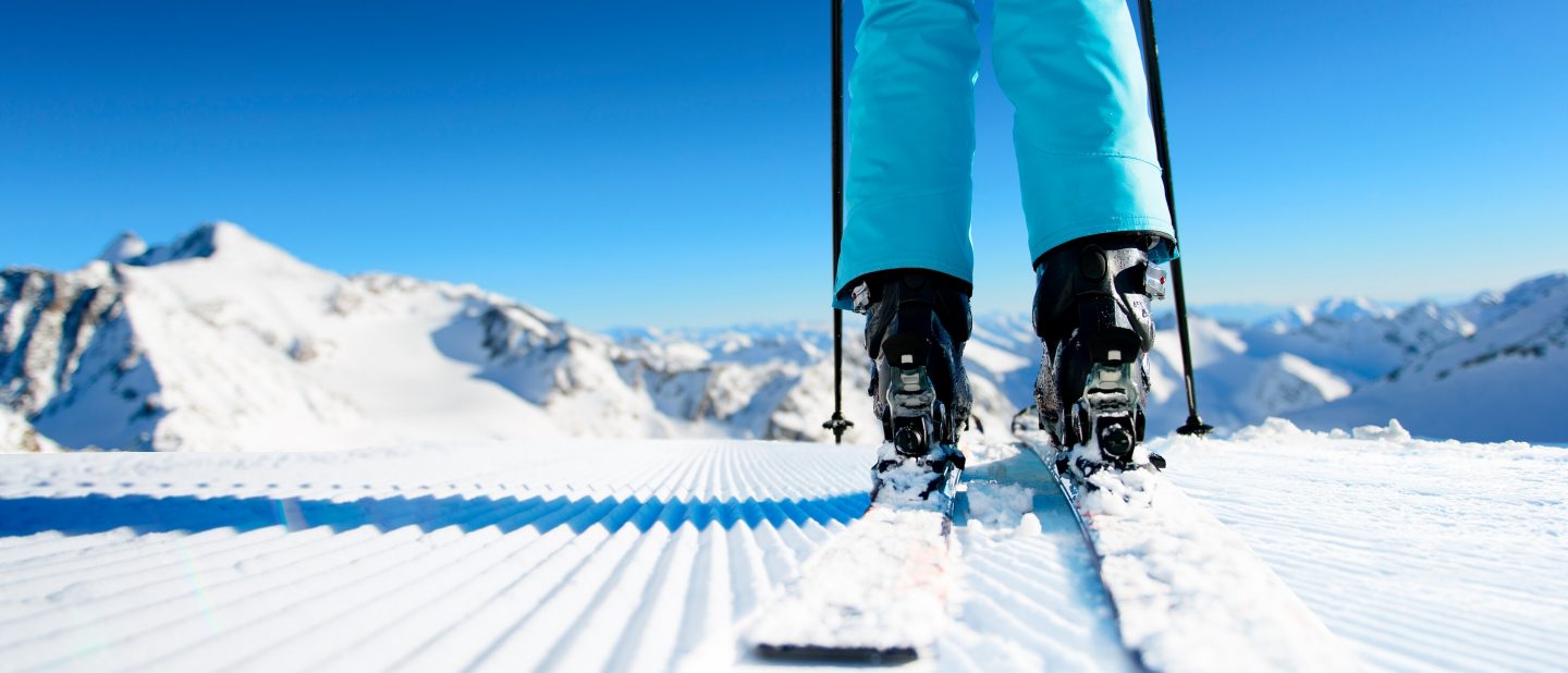 Skier standing on a freshly prepared ski slope