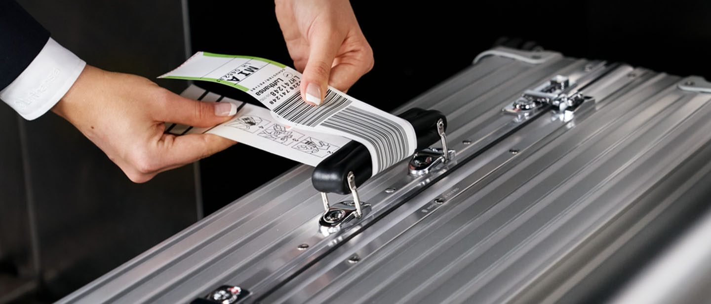 Suitcase receives a label.