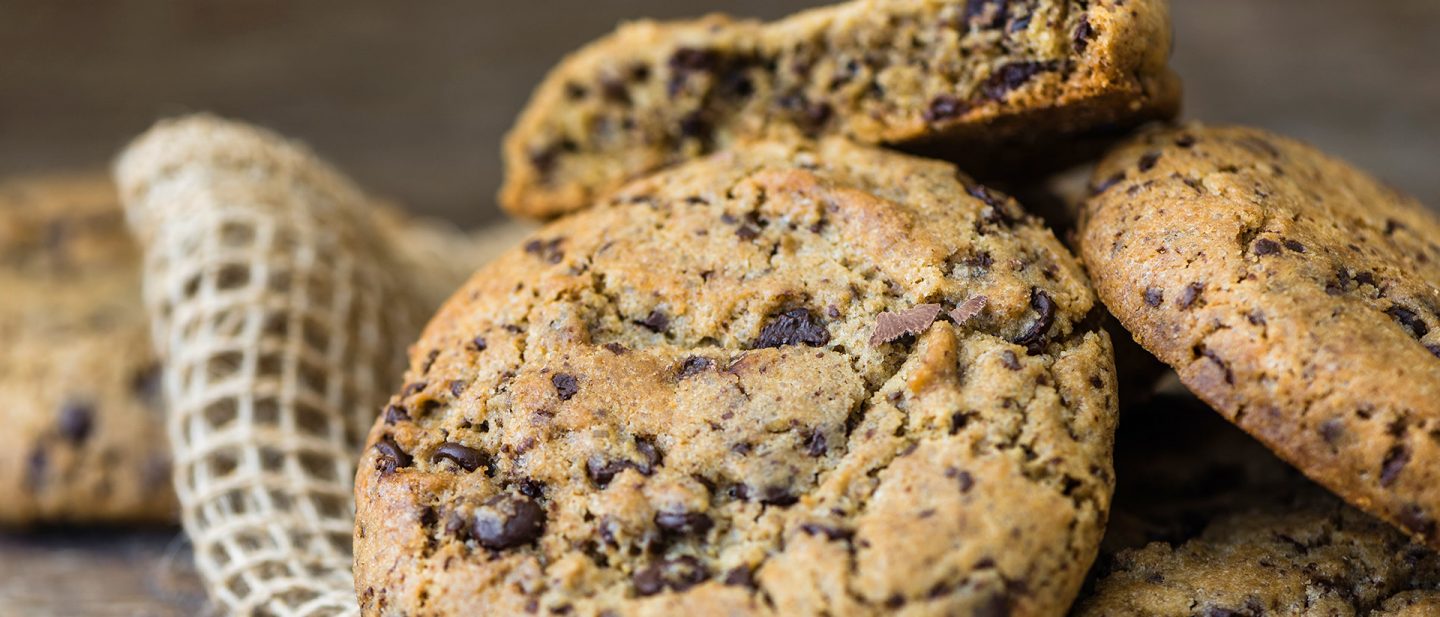 Close-up of freshly baked Eccles cakes on a rustic background