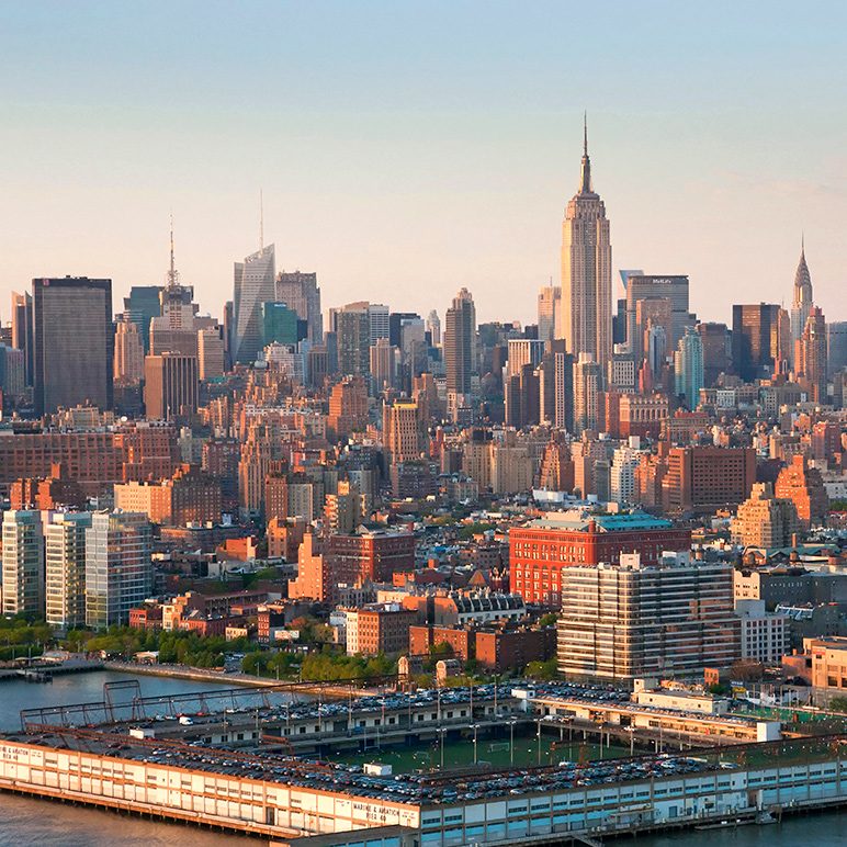 New York City skyline and Empire State Building in warm sunlight