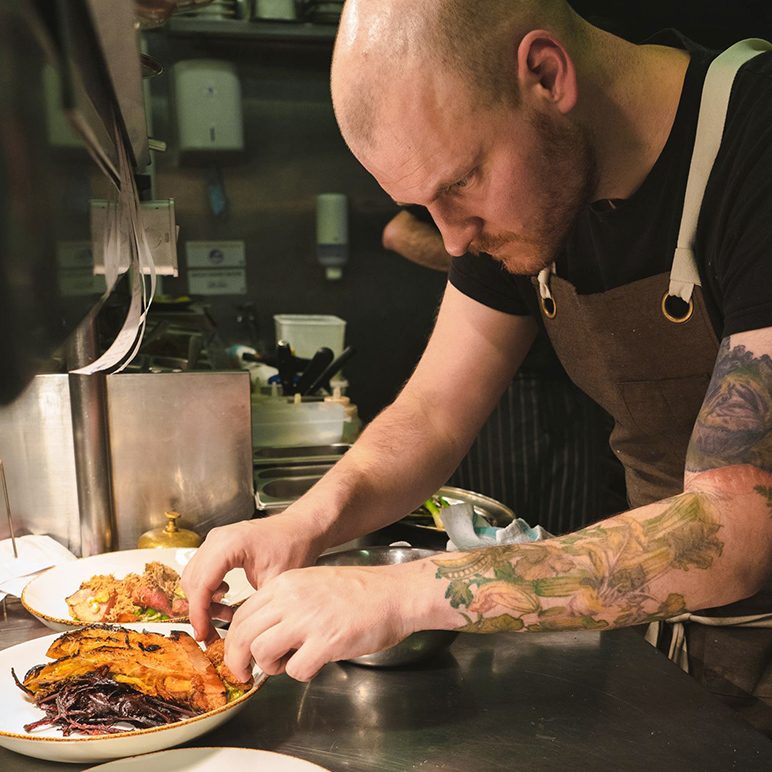Malte Half plating food in a restaurant kitchen in Dublin