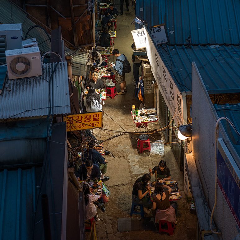 View from above of a busy alleyway in the Euljiro district of Seoul at night