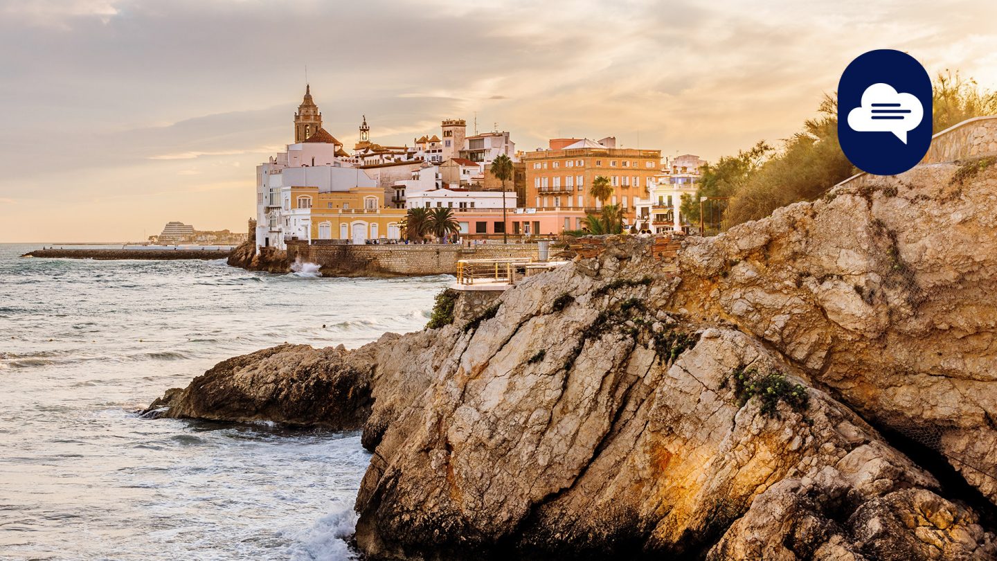 Team Stories: Sunset in Sitges, overlooking the coastline and historic buildings