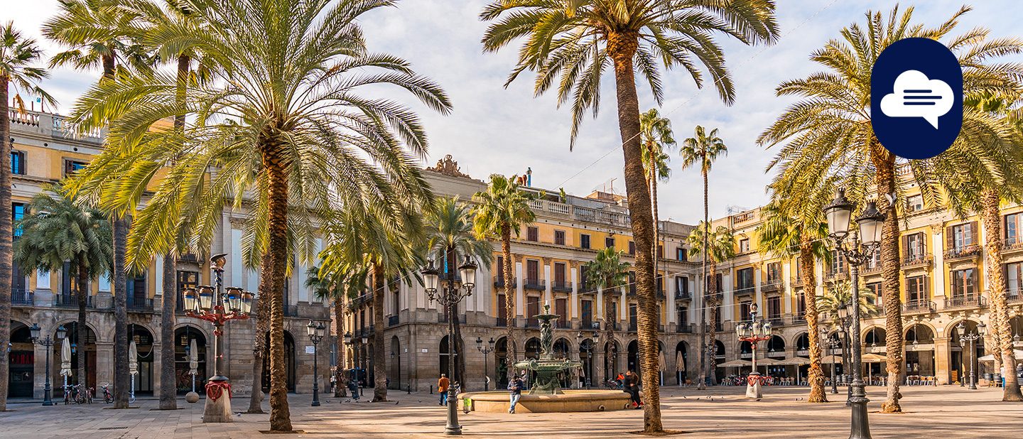Plaça Reial in Barcelona with palm trees and arcades in morning light